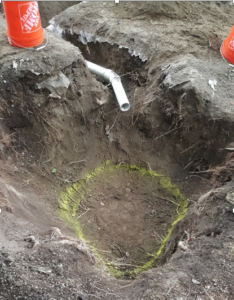 Excavating the bottom area after trenching your inlet pipe makes it easier to measure and meet the requirements for bottom area and depth. 